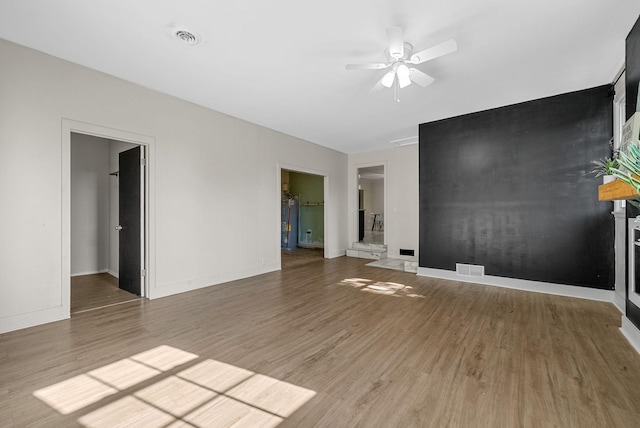 1872 River Rd, Clarksville, TN 37040 - unfurnished living room with a ceiling fan and wood finished floors