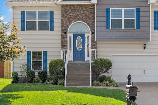 3754 Gray Fox Dr, Clarksville, TN 37040 - view of front of home with a front lawn, stone siding, and an attached garage