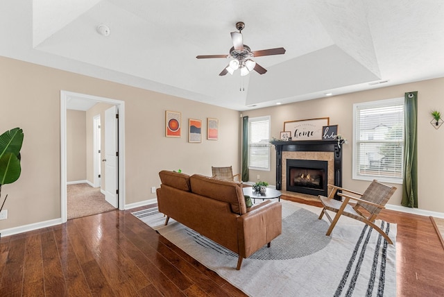 3754 Gray Fox Dr, Clarksville, TN 37040 - living room featuring a raised ceiling, wood finished floors, a tile fireplace, plenty of natural light, and recessed lighting