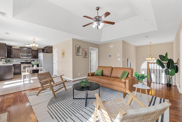 3754 Gray Fox Dr, Clarksville, TN 37040 - living area featuring a chandelier, light wood-style flooring, ceiling fan, and a raised ceiling
