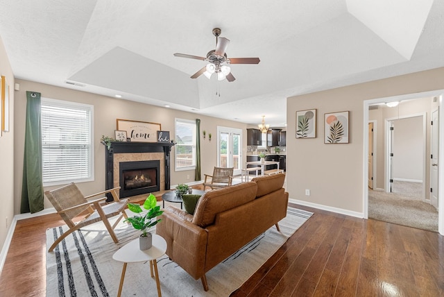 3754 Gray Fox Dr, Clarksville, TN 37040 - living room with dark wood-style flooring, a fireplace, ceiling fan, a raised ceiling, and recessed lighting