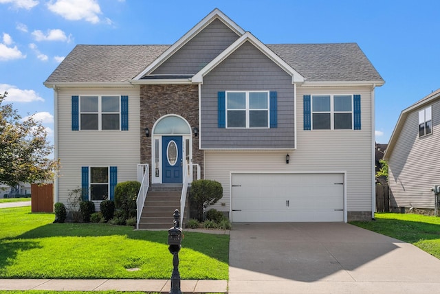 3754 Gray Fox Dr, Clarksville, TN 37040 - bi-level home featuring a front yard, concrete driveway, an attached garage, and stone siding