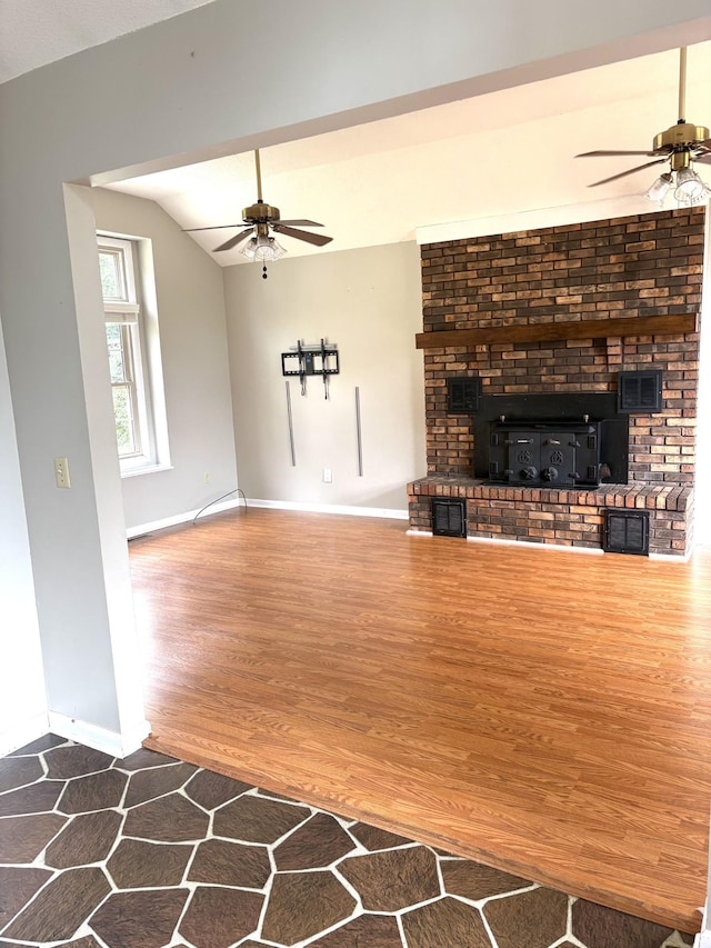 806 Sharon Cir, Lawrenceburg, TN 38464 - unfurnished living room featuring a ceiling fan, wood finished floors, and vaulted ceiling