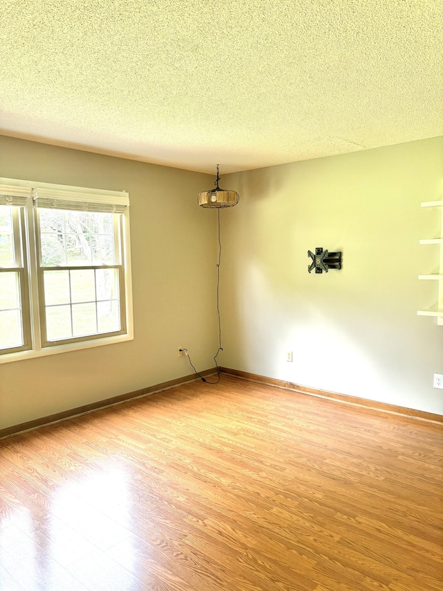 806 Sharon Cir, Lawrenceburg, TN 38464 - spare room featuring light wood-style floors and a textured ceiling