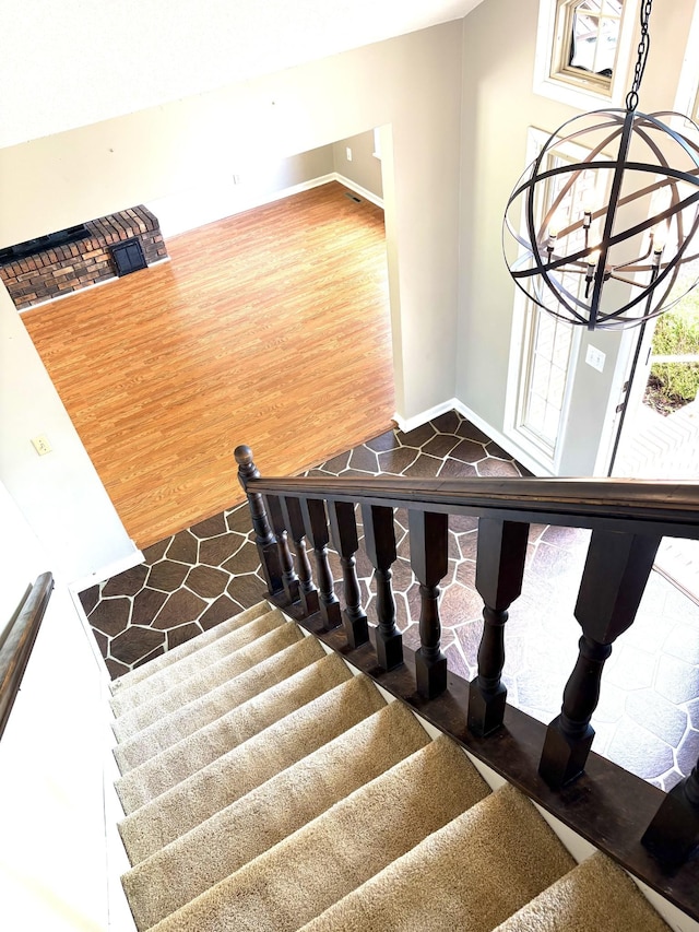 806 Sharon Cir, Lawrenceburg, TN 38464 - staircase featuring a chandelier and wood finished floors