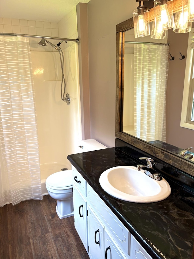 806 Sharon Cir, Lawrenceburg, TN 38464 - bathroom featuring vanity, wood finished floors, and a shower with shower curtain