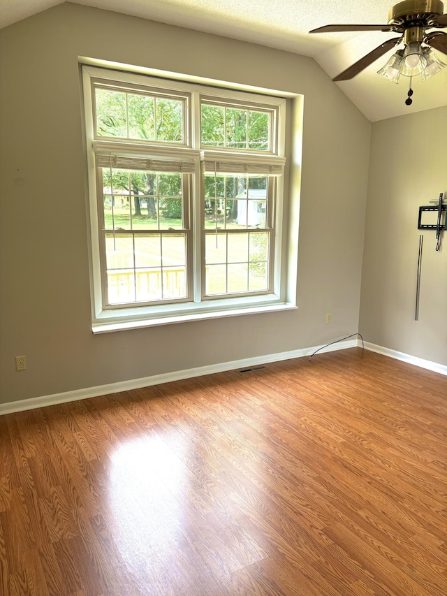 806 Sharon Cir, Lawrenceburg, TN 38464 - empty room featuring lofted ceiling, wood finished floors, and a ceiling fan