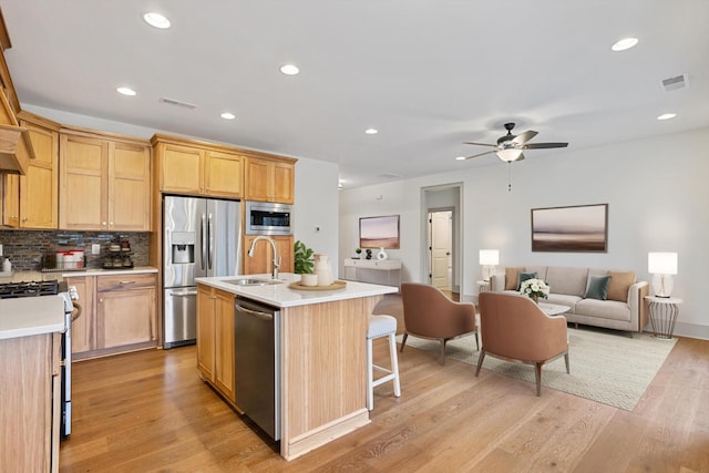 3200 Crockett Pointe, Jasper, TN 37347 - kitchen with appliances with stainless steel finishes, open floor plan, light countertops, a ceiling fan, and light wood-type flooring