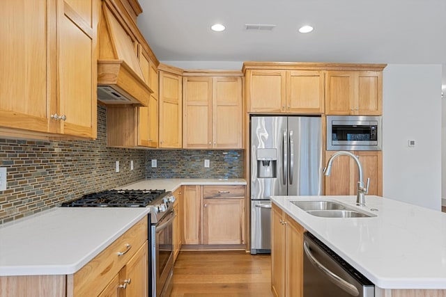 3200 Crockett Pointe, Jasper, TN 37347 - kitchen featuring appliances with stainless steel finishes, custom range hood, light countertops, tasteful backsplash, and light wood-style flooring