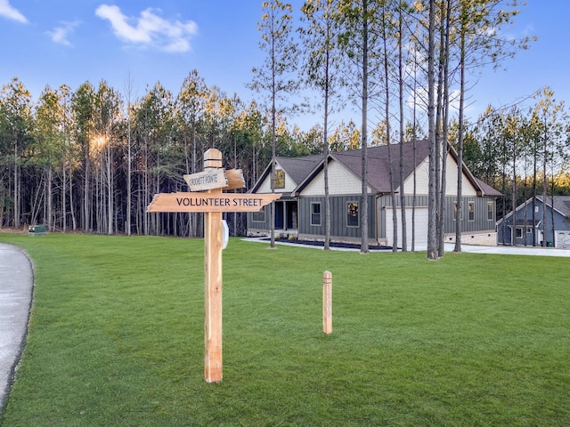 3200 Crockett Pointe, Jasper, TN 37347 - view of front of home with board and batten siding and a front lawn