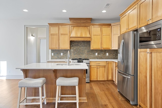 3200 Crockett Pointe, Jasper, TN 37347 - kitchen featuring stainless steel appliances, custom range hood, light wood-type flooring, tasteful backsplash, and recessed lighting
