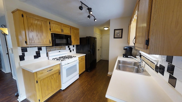 308 Eli Ct, Columbia, TN 38401 - kitchen with black appliances, dark wood finished floors, decorative backsplash, and light countertops