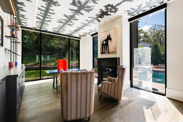 4606 Shys Hill Rd, Nashville, TN 37215 - living room featuring wood finished floors and a wall of windows