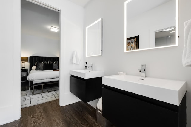 4606 Shys Hill Rd, Nashville, TN 37215 - bathroom featuring wood finished floors, two vanities, and ensuite bathroom