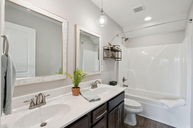 4711 Compassion Ln, Murfreesboro, TN 37128 - bathroom featuring tub / shower combination, double vanity, and wood finished floors