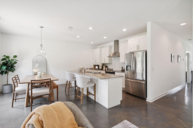 4711 Compassion Ln, Murfreesboro, TN 37128 - kitchen featuring stainless steel refrigerator with ice dispenser, wall chimney range hood, concrete flooring, a center island with sink, and white cabinetry