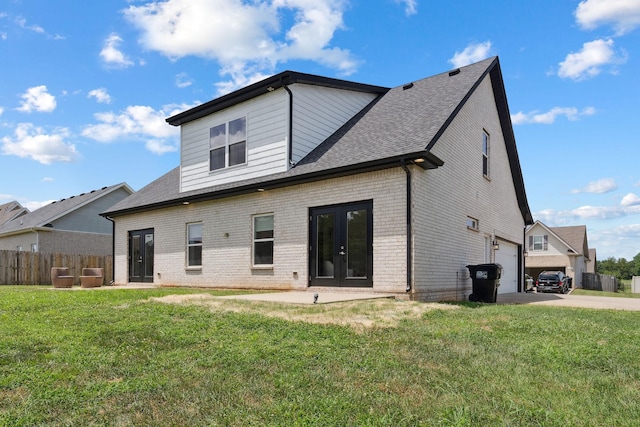 4711 Compassion Ln, Murfreesboro, TN 37128 - rear view of house featuring brick siding, french doors, an attached garage, and concrete driveway