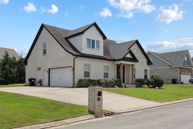4711 Compassion Ln, Murfreesboro, TN 37128 - view of front of house featuring driveway, a garage, brick siding, a front yard, and roof with shingles