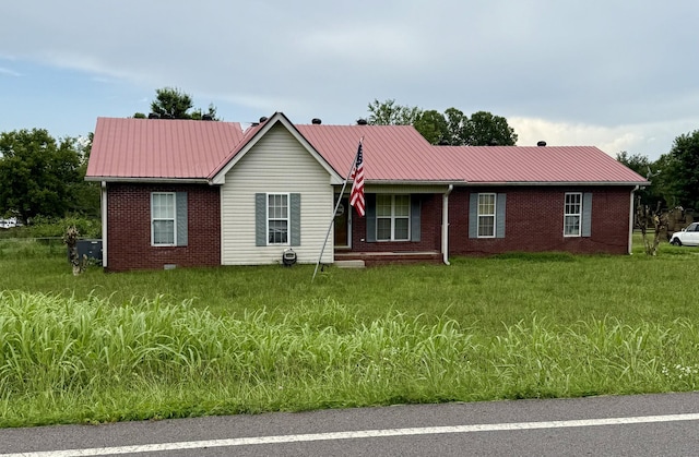 599 Goshen Rd, Lebanon, TN 37087 - ranch-style house featuring brick siding, a metal roof, and a front yard