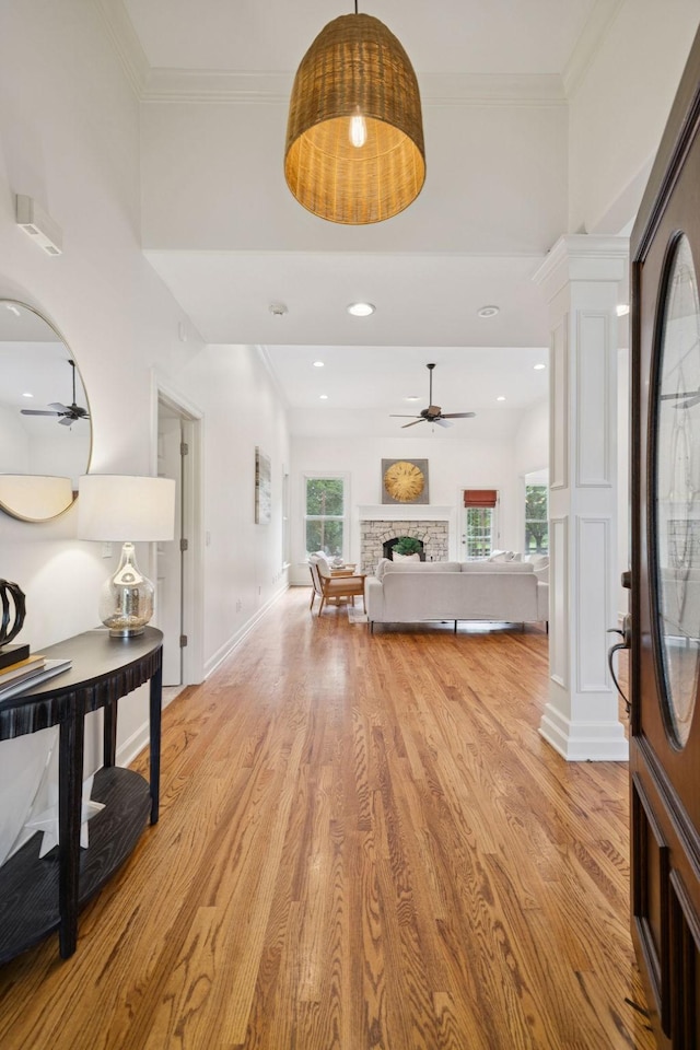 2000 Far Fara Way, Brentwood, TN 37027 - entryway with ceiling fan, light wood-type flooring, a fireplace, ornamental molding, and ornate columns