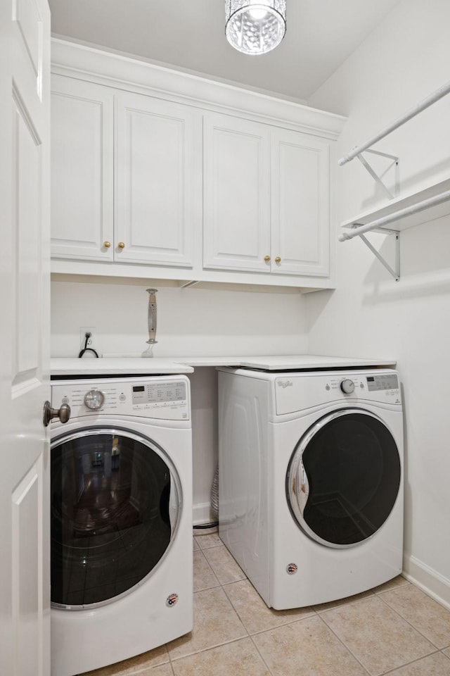 2000 Far Fara Way, Brentwood, TN 37027 - washroom featuring washer and clothes dryer, cabinet space, and light tile patterned flooring