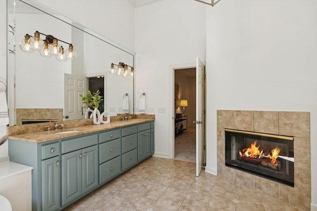 2000 Far Fara Way, Brentwood, TN 37027 - full bath featuring double vanity, a fireplace, a towering ceiling, and tile patterned flooring
