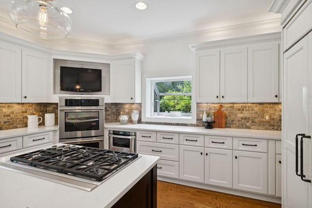 2000 Far Fara Way, Brentwood, TN 37027 - kitchen featuring appliances with stainless steel finishes, white cabinets, backsplash, crown molding, and recessed lighting
