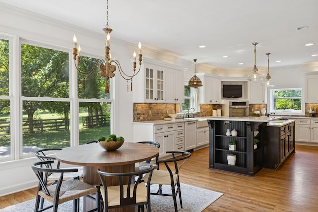 2000 Far Fara Way, Brentwood, TN 37027 - dining space with ornamental molding, light wood finished floors, a chandelier, and recessed lighting