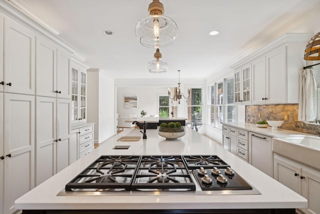 2000 Far Fara Way, Brentwood, TN 37027 - kitchen featuring stainless steel gas cooktop, light countertops, a kitchen island, tasteful backsplash, and recessed lighting