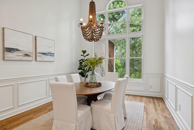 2000 Far Fara Way, Brentwood, TN 37027 - dining room with a chandelier, a decorative wall, light wood finished floors, and wainscoting
