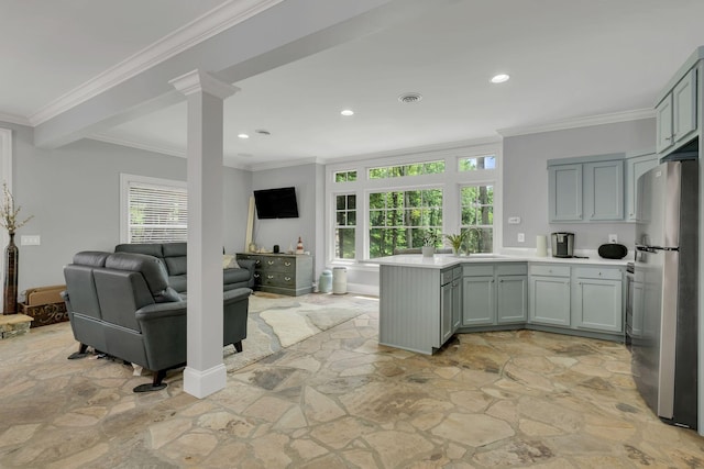 3120 Boxley View Ln, Franklin, TN 37064 - kitchen with stone floors, freestanding refrigerator, a peninsula, light countertops, and recessed lighting