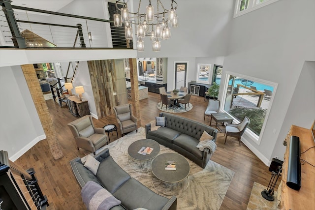 3120 Boxley View Ln, Franklin, TN 37064 - living area with a high ceiling, wood finished floors, a chandelier, and stairway