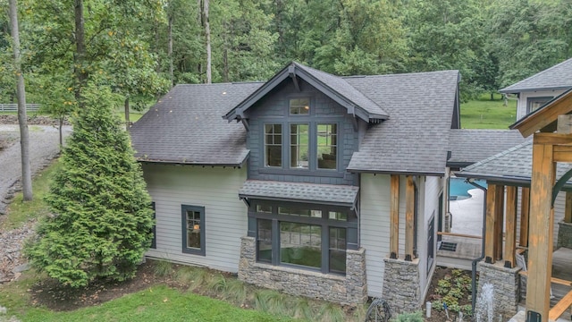 3120 Boxley View Ln, Franklin, TN 37064 - view of front of home with a shingled roof, stone siding, and a view of trees