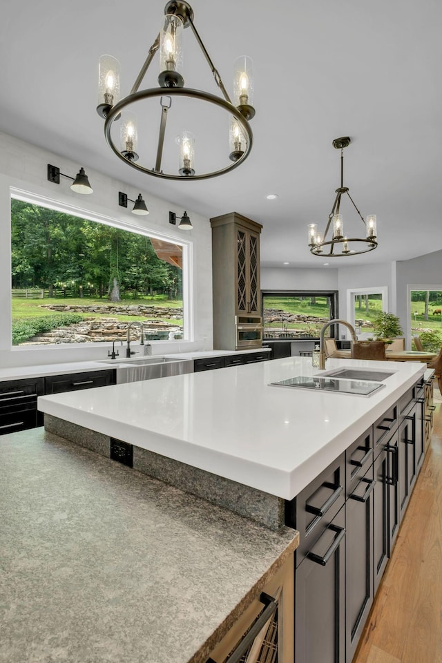 3120 Boxley View Ln, Franklin, TN 37064 - kitchen with a chandelier, decorative light fixtures, light countertops, a center island, and recessed lighting