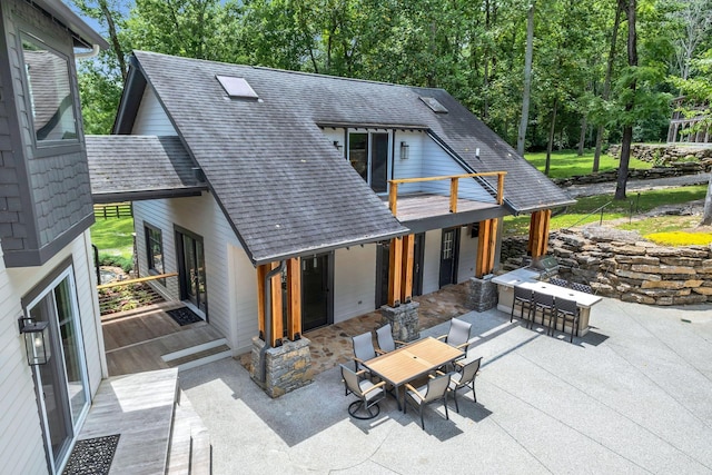 3120 Boxley View Ln, Franklin, TN 37064 - rear view of house with a patio area, outdoor dining area, and roof with shingles