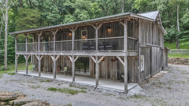 3120 Boxley View Ln, Franklin, TN 37064 - back of property featuring a wooded view and a metal roof