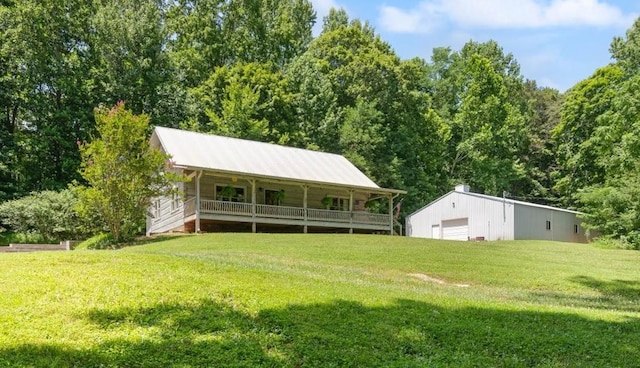 3000 Preston Bagwell Rd, Clarksville, TN 37043 - back of house with a detached garage, a yard, and an outbuilding