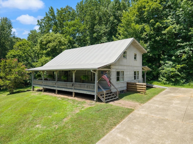 3000 Preston Bagwell Rd, Clarksville, TN 37043 - view of front of property with a front lawn, a metal roof, and a wooden deck