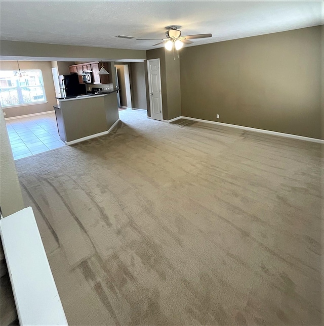 3164 Prater Ct, Murfreesboro, TN 37128 - unfurnished living room with light carpet, a ceiling fan, and a chandelier