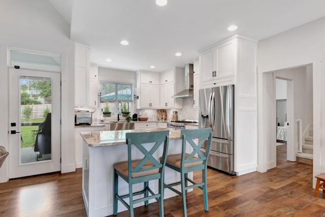 332 Country Club Rd, Winchester, TN 37398 - kitchen with stainless steel fridge, wall chimney range hood, white cabinets, tasteful backsplash, and dark wood-type flooring