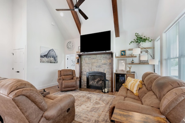 332 Country Club Rd, Winchester, TN 37398 - living area with beverage cooler, high vaulted ceiling, a ceiling fan, beam ceiling, and a stone fireplace