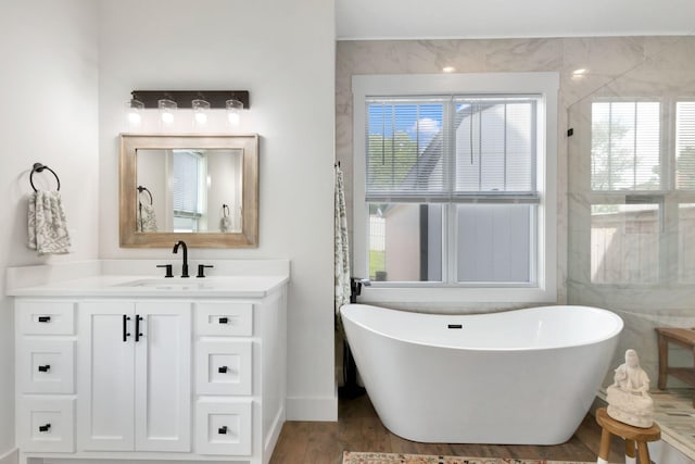 332 Country Club Rd, Winchester, TN 37398 - full bathroom with a soaking tub, vanity, and wood finished floors
