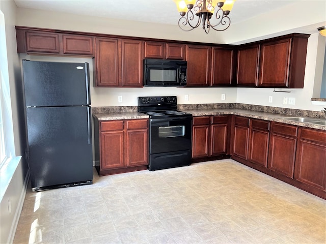 3754 Chippewa Pl, Murfreesboro, TN 37128 - kitchen featuring black appliances, a chandelier, and dark countertops