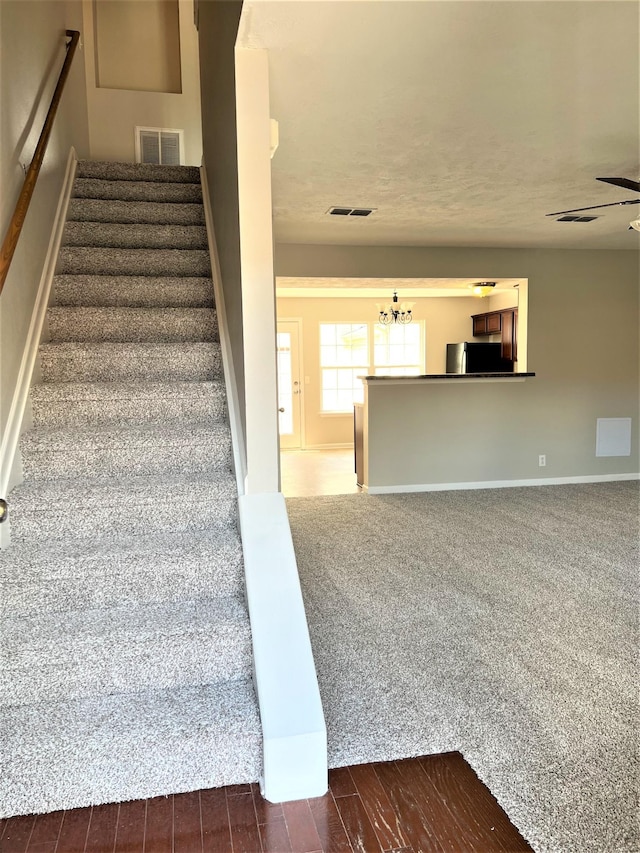 3754 Chippewa Pl, Murfreesboro, TN 37128 - staircase featuring baseboards and a chandelier