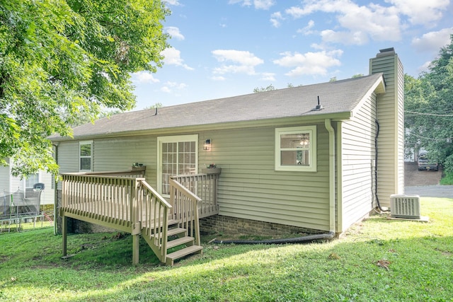 1204 Lambeth Way, Antioch, TN 37013 - rear view of property with a wooden deck, a trampoline, a chimney, and a lawn