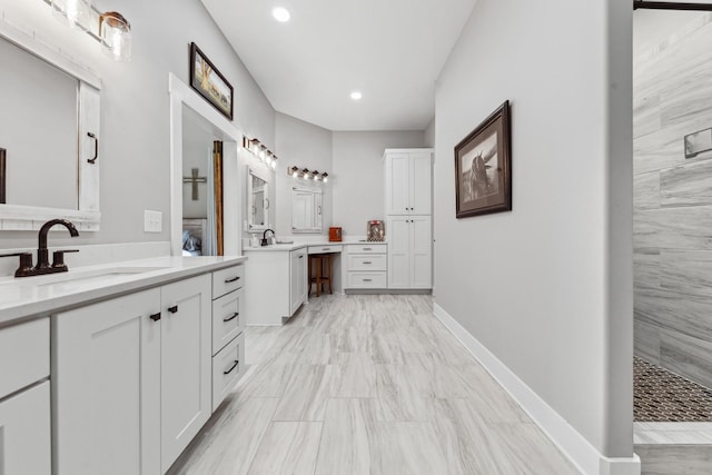5247 Flat Creek Rd, Spring Hill, TN 37174 - bathroom featuring two vanities, recessed lighting, and tiled shower