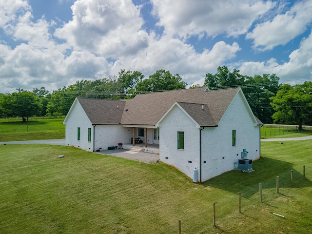 5247 Flat Creek Rd, Spring Hill, TN 37174 - rear view of property with a patio, roof with shingles, and brick siding