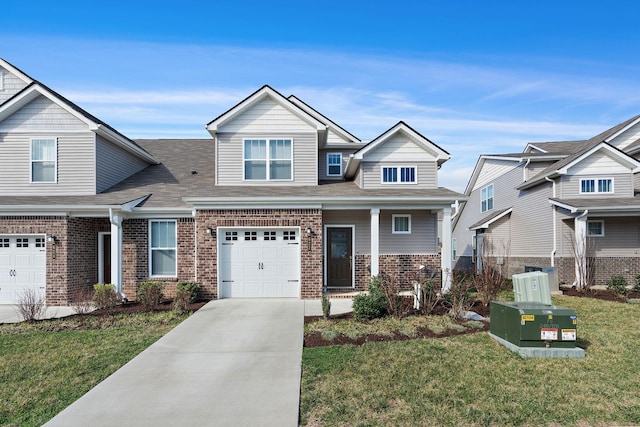 622 Birdie Dr, Spring Hill, TN 37174 - craftsman-style home featuring brick siding, concrete driveway, a front yard, and a garage