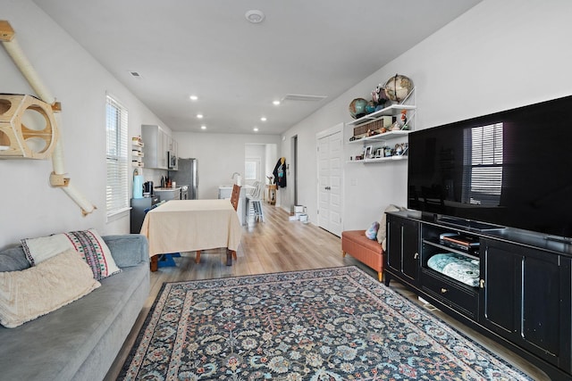 622 Birdie Dr, Spring Hill, TN 37174 - living area featuring light wood-type flooring and recessed lighting