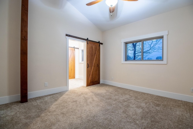 1224 Hangar Dr, Springfield, TN 37172 - unfurnished bedroom with vaulted ceiling, carpet floors, a barn door, and ceiling fan